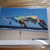 towels on clothes line on a beach photo card