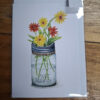 drawn flowers in glass jar on card